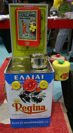 A toy kitchen stove made from reused tins and jar caps